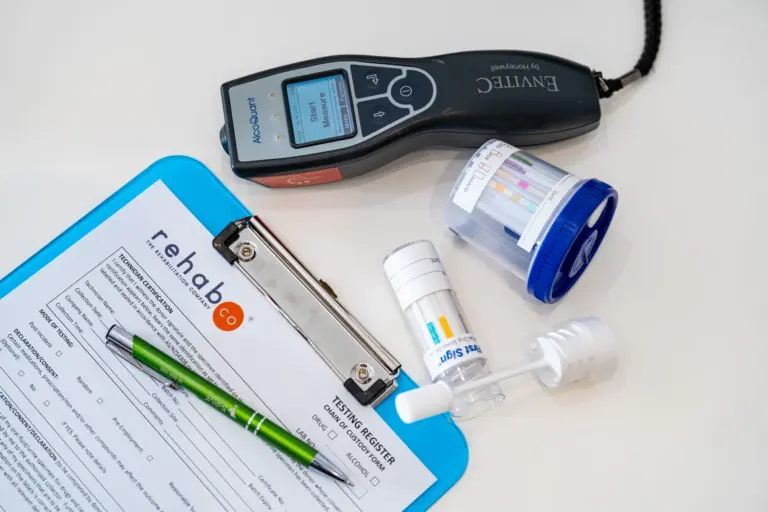 Drug and alcohol screening kit and testing equipment on a clipboard