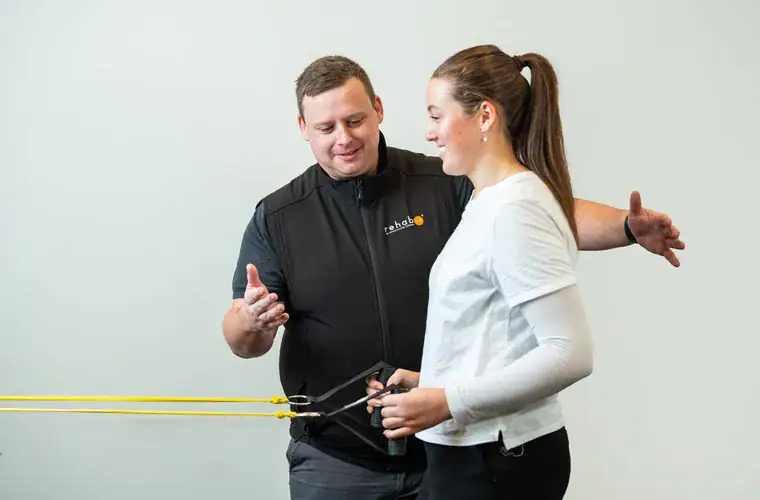 A Rehab Co clinician leading a manual handling training session
