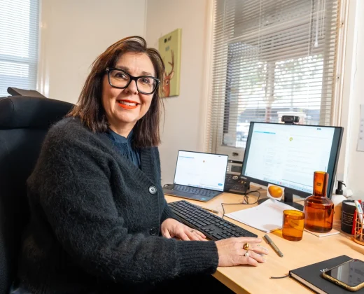 Rehab Co consultant providing job seeking and resume support at a desk